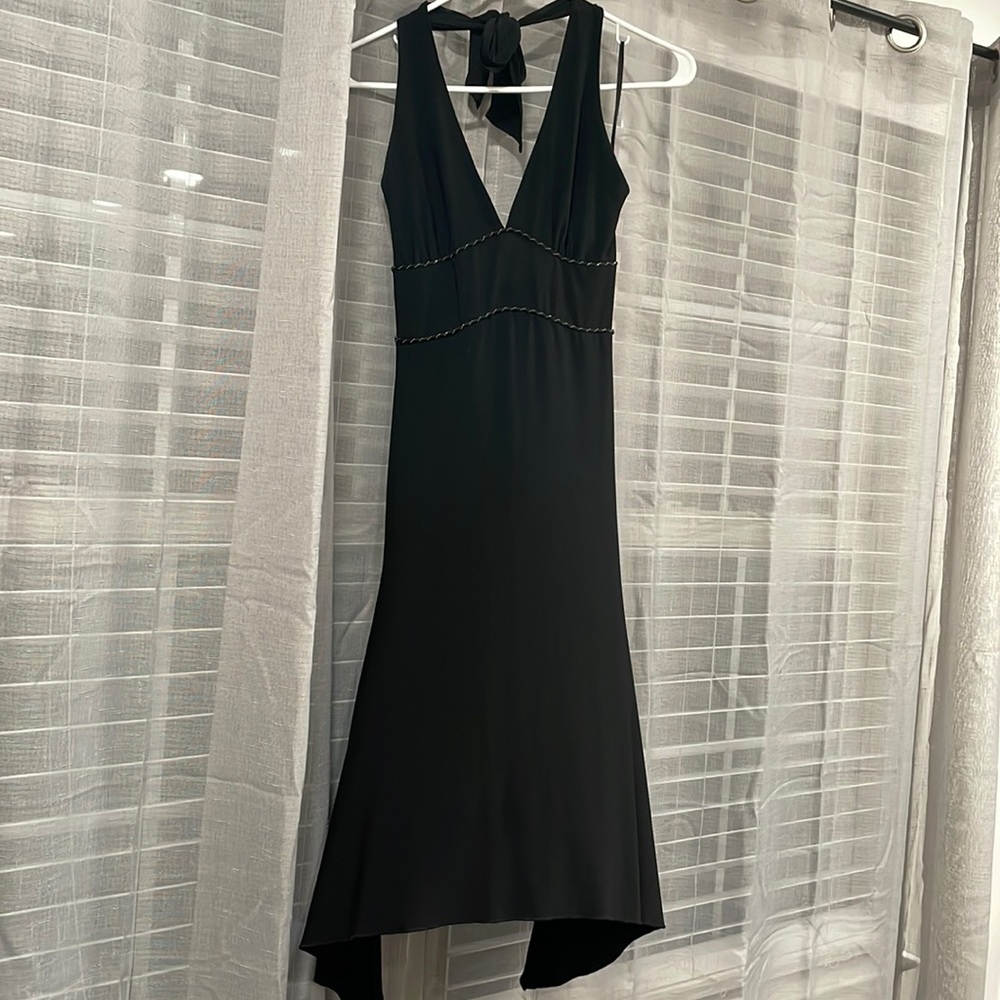 Black polyester halter dress with asymmetrical bottom. Size small